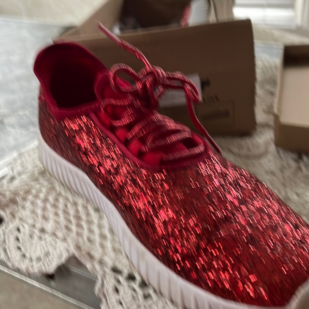 Red sparkle tennis shoe